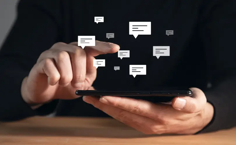 Person checking phone with transactional SMS notification preview
